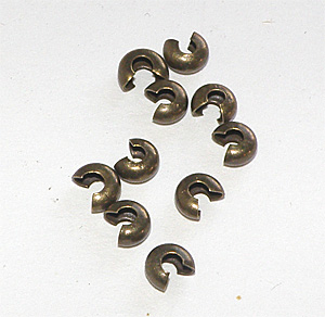 Bronsfärgad klämpärlegömma 4 mm
