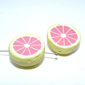 Polymer röd grapefrukthalva ca 22×11 mm