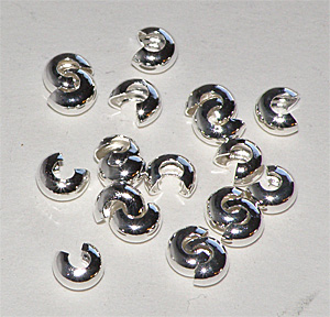 Silverfärgad klämpärlegömma 4 mm