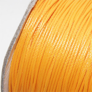 Vaxad bomullstråd ljus orange 0,5 mm