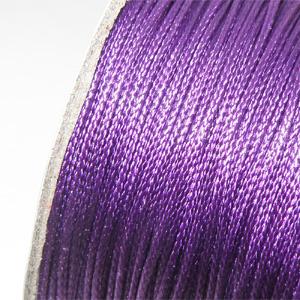 Vaxad polyestertråd lila 0,5 mm